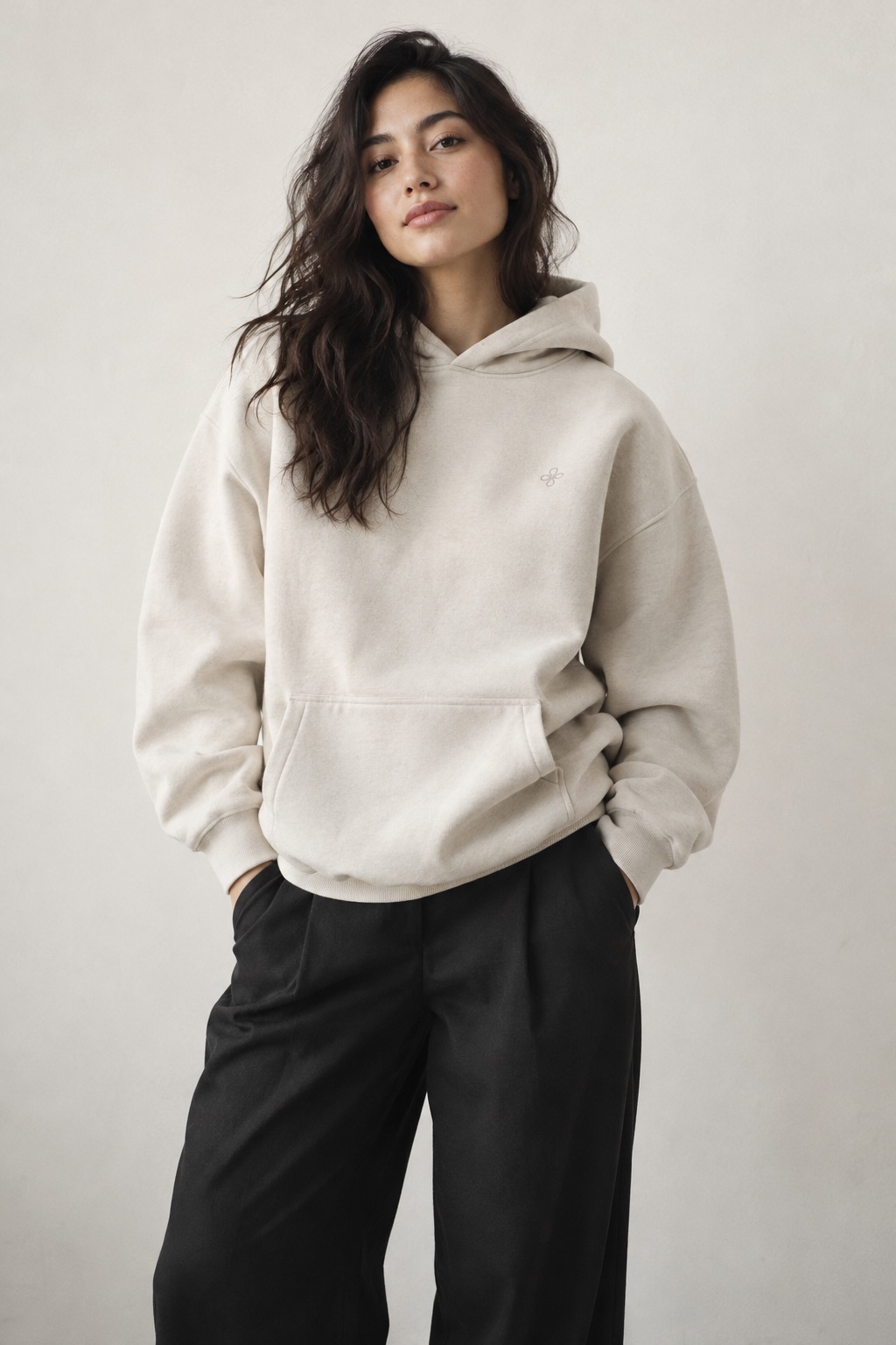 A creator in an oversized bone heavyweight hoodie
